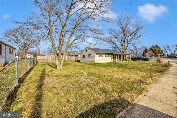 a view of yard with swimming pool and trees