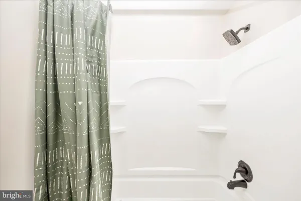 a bathroom with a sink toilet and a mirror