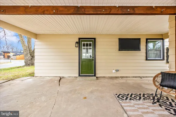 a front view of house with yard and trees