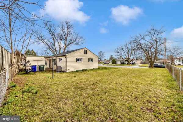 a view of a house with large windows