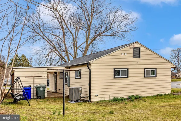a view of swimming pool with bench and wooden fence
