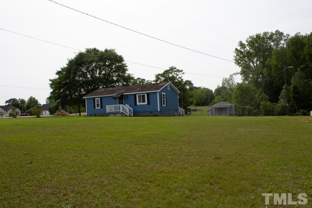 9592 Kennebec Road Willow Spring, NC 27592 - Photo 3 of 14 a front view of house with yard and green space