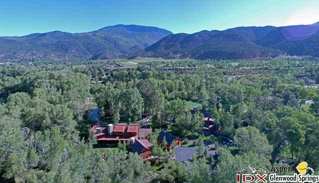 200 Altamira Ranch Road Basalt, CO 81621 - Photo 2 of 26 a view of a lush green hillside and a houses
