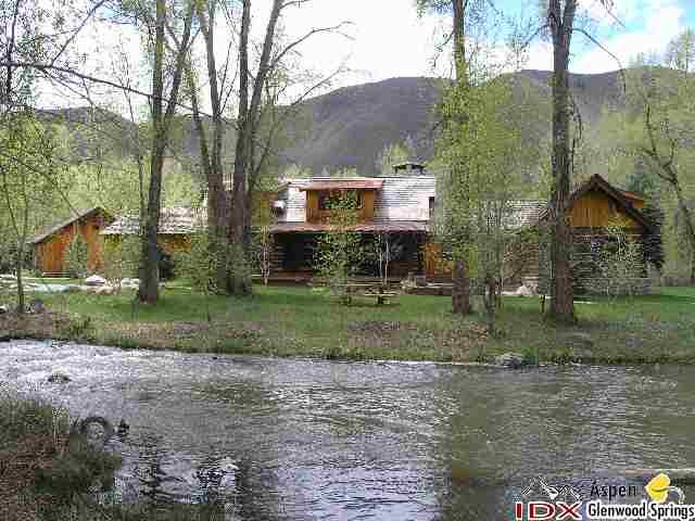 200 Altamira Ranch Road Basalt, CO 81621 - Photo 3 of 26 a view of a house with a yard and a fountain