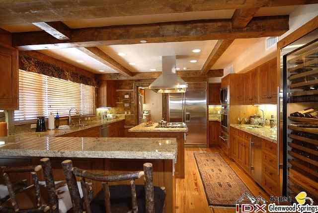 200 Altamira Ranch Road Basalt, CO 81621 - Photo 10 of 26 a kitchen with granite countertop lots of counter top space and stainless steel appliances