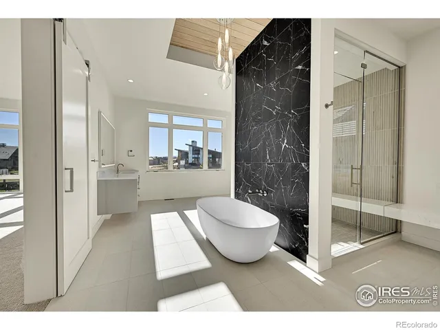 a bathroom with a sink mirror and vanity