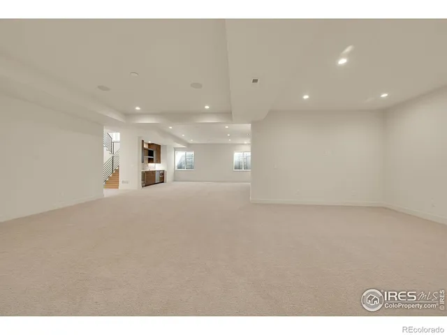 a view of a kitchen with a sink and a large window
