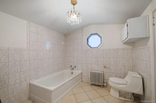 a bathroom with a toilet sink and bathtub