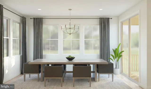 a view of a dining room with furniture and window
