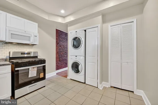 a view of a kitchen with washer and dryer