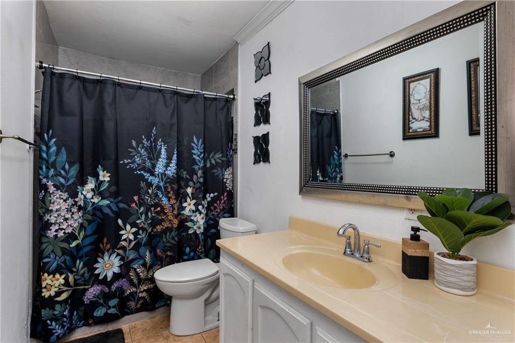 118 J R Becerra Avenue Progreso, TX 78596 - Photo 10 of 17 a bathroom with a sink toilet and shower