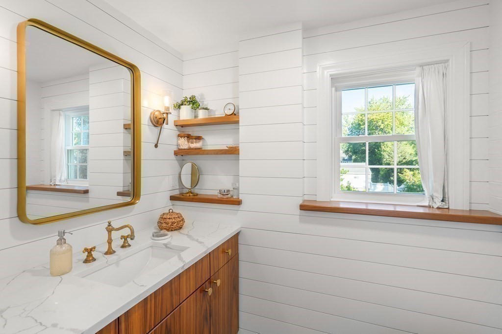 3 Castle Avenue Medfield, MA 02052 - Photo 13 of 36 a bathroom with a sink and a mirror