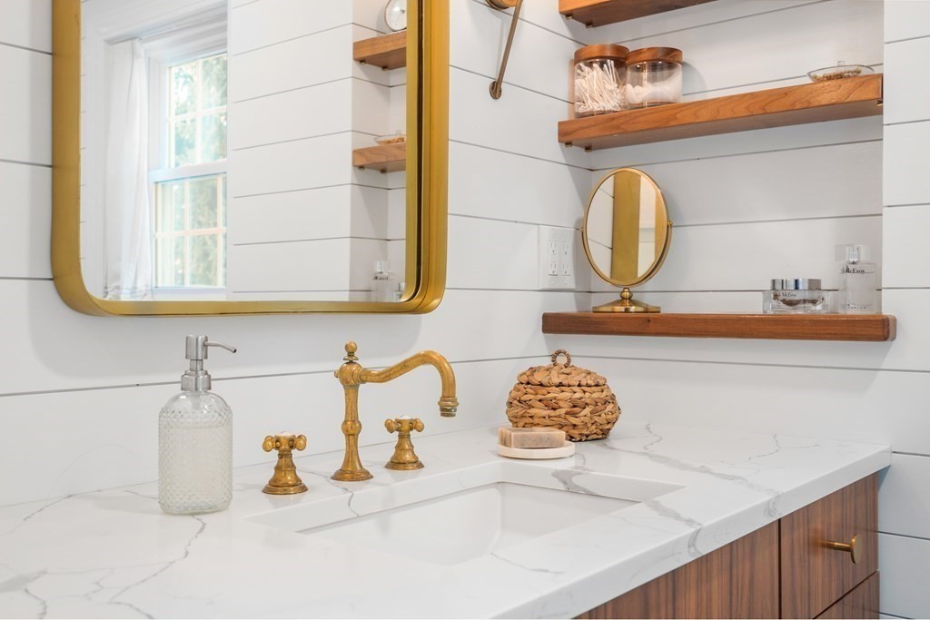 3 Castle Avenue Medfield, MA 02052 - Photo 15 of 36 a bathroom with a sink and a mirror