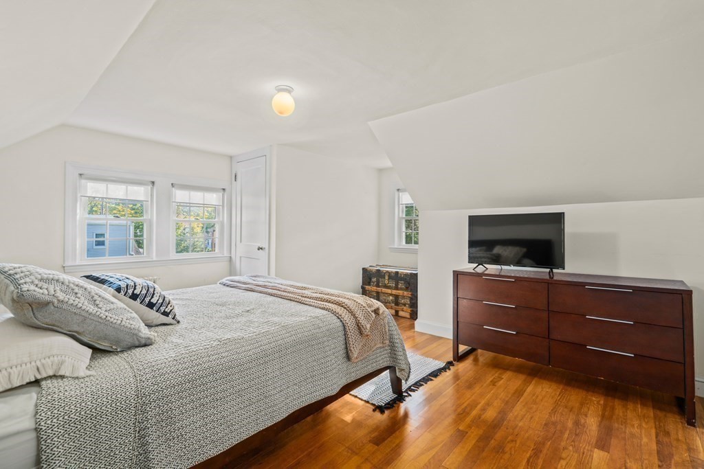 3 Castle Avenue Medfield, MA 02052 - Photo 19 of 36 a bedroom with a bed and a flat screen tv