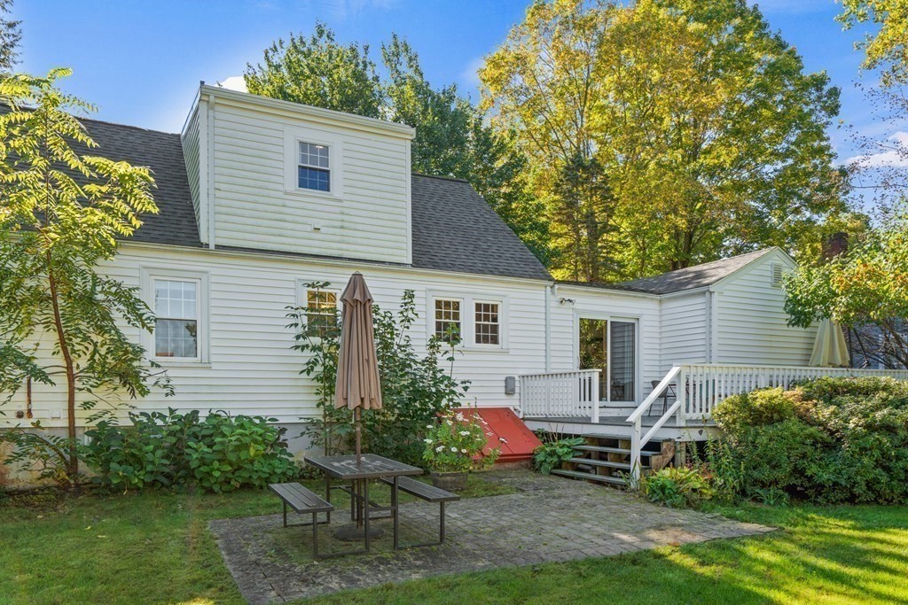 3 Castle Avenue Medfield, MA 02052 - Photo 34 of 36 a backyard of a house with table and chairs