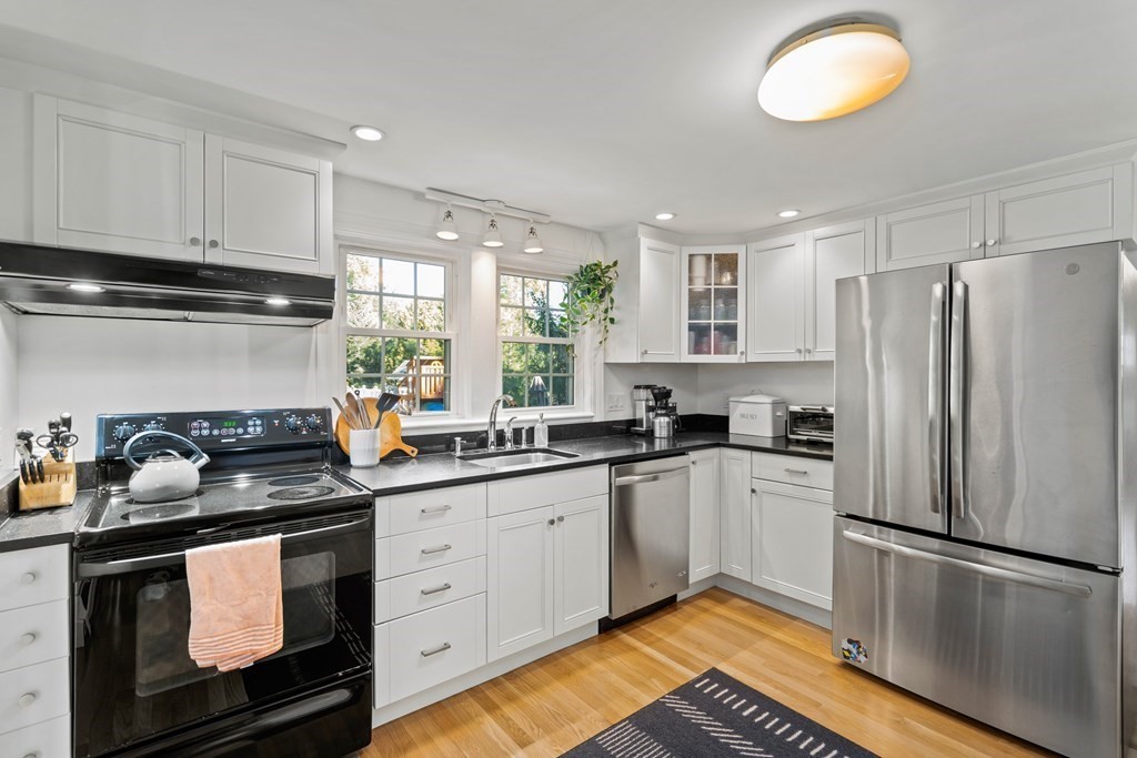 3 Castle Avenue Medfield, MA 02052 - Photo 4 of 36 a kitchen with a sink stove and refrigerator