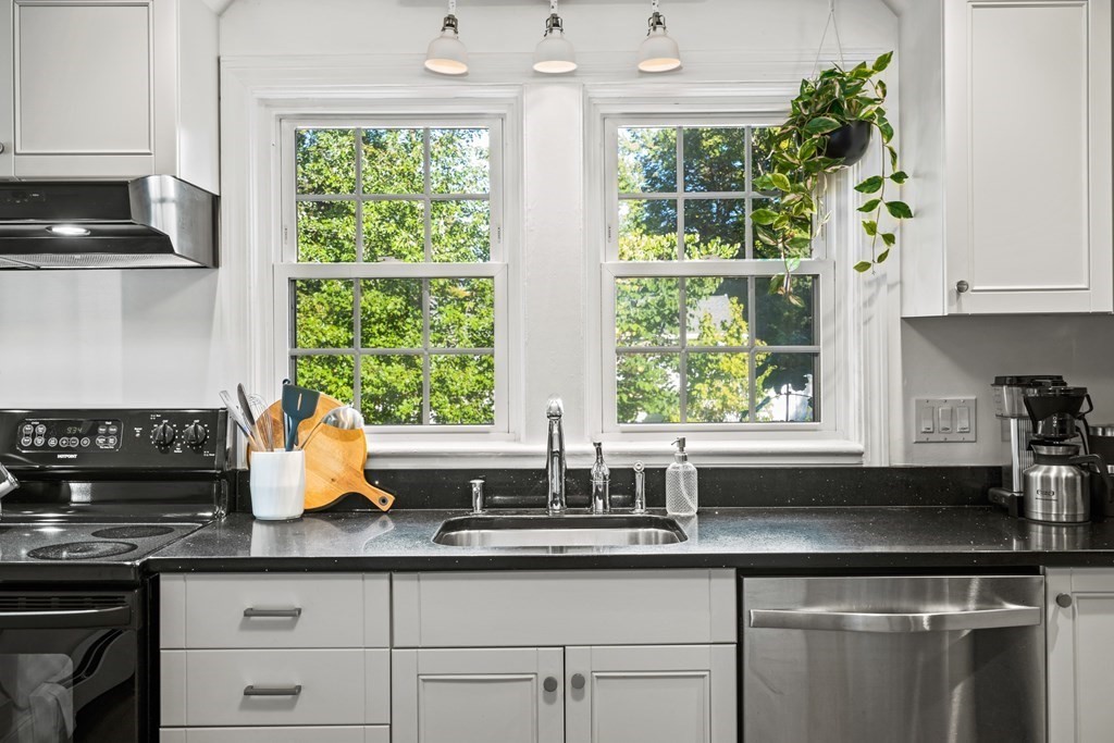 3 Castle Avenue Medfield, MA 02052 - Photo 5 of 36 a kitchen with stainless steel appliances a sink a window and cabinets