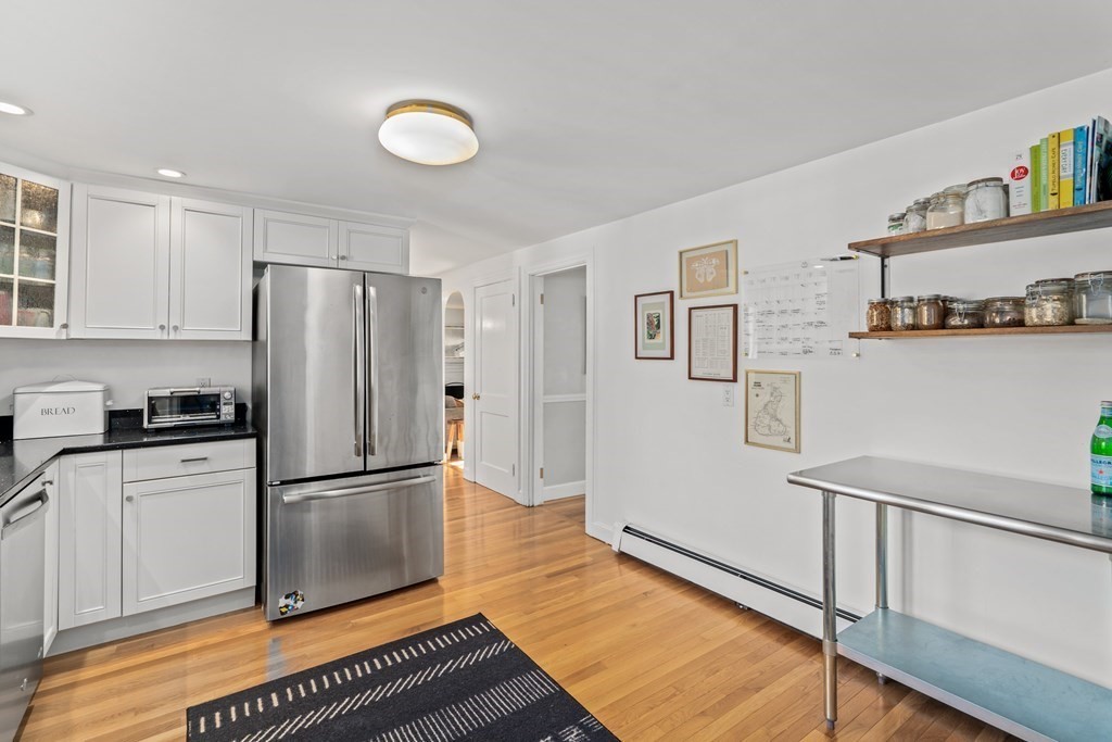 3 Castle Avenue Medfield, MA 02052 - Photo 7 of 36 a kitchen with stainless steel appliances a refrigerator and a stove top oven