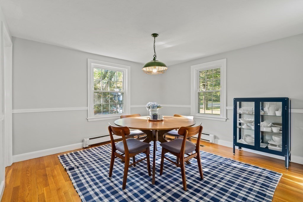 3 Castle Avenue Medfield, MA 02052 - Photo 9 of 36 a dining room with chandelier and wooden floor