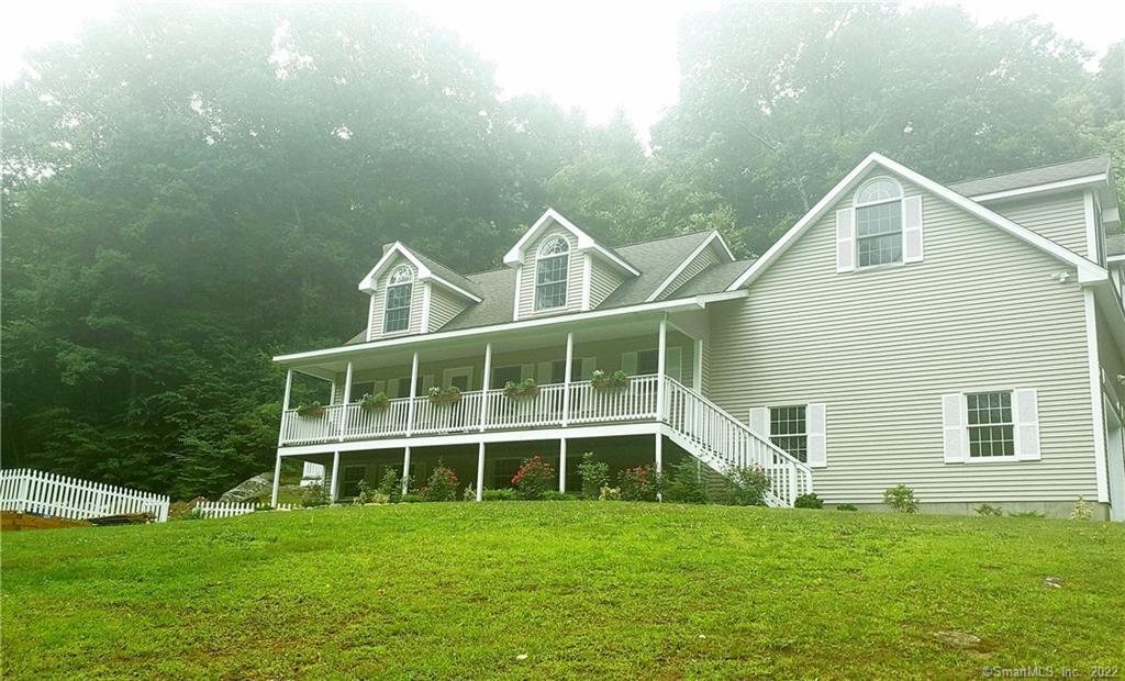 97 Burbank Road Tolland, CT 06084 - Photo 1 of 1 a house view with a garden space