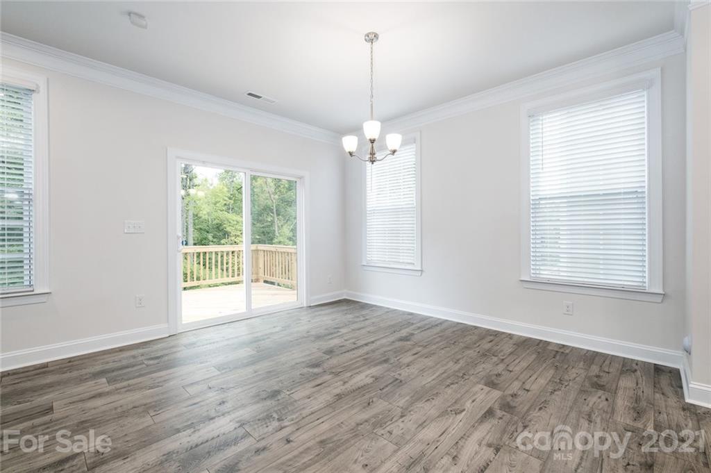 420 Preston Road Mooresville, NC 28117 - Photo 11 of 39 wooden floor in an empty room with a window