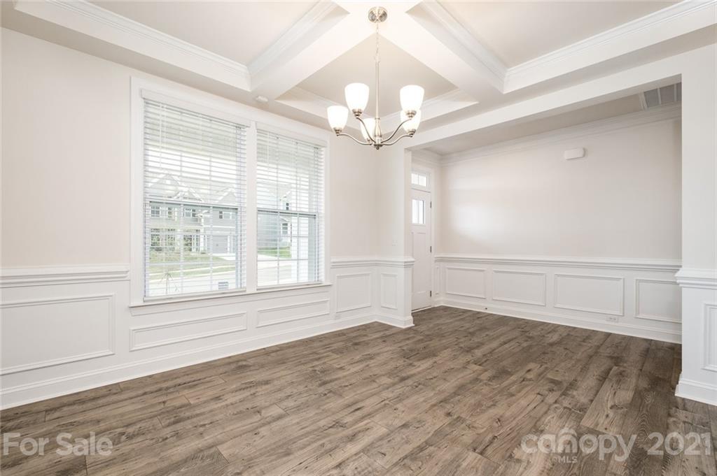 420 Preston Road Mooresville, NC 28117 - Photo 3 of 39 a view of an empty room with wooden floor and a window