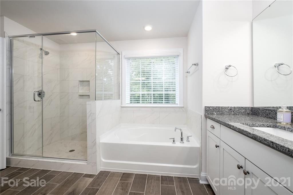 420 Preston Road Mooresville, NC 28117 - Photo 25 of 39 a bathroom with a granite countertop tub shower and sink