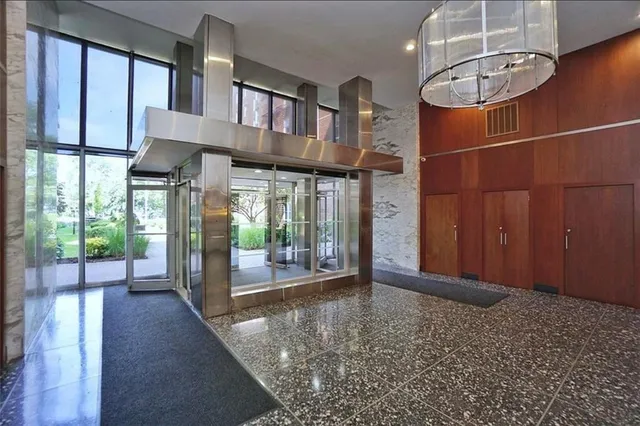 a view of an entryway with a floor to ceiling window