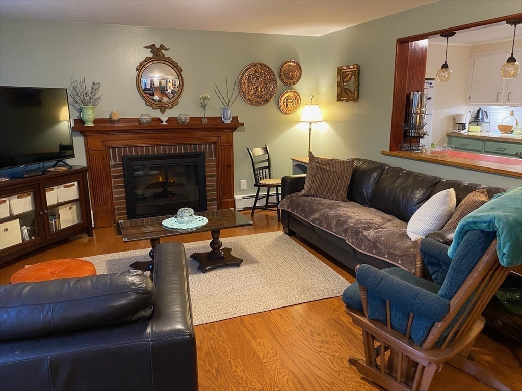 616 County Road Barrington, RI 02806 - Photo 12 of 32 a living room with furniture and a fireplace