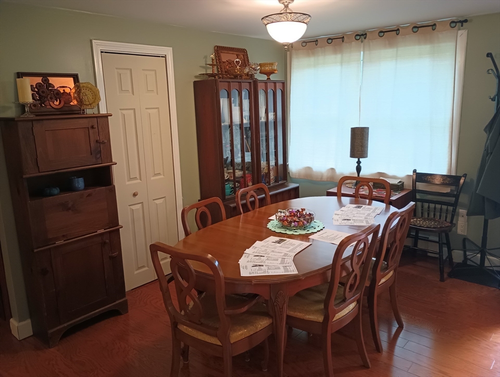 616 County Road Barrington, RI 02806 - Photo 14 of 32 a view of a dining room with furniture and wooden floor