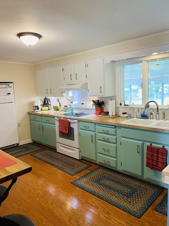 616 County Road Barrington, RI 02806 - Photo 16 of 32 a kitchen with a sink and cabinets
