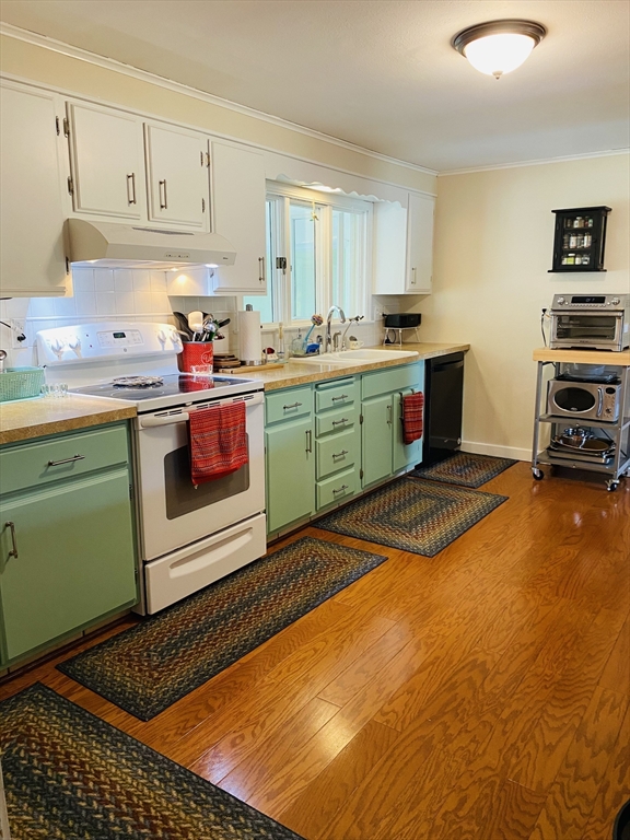 616 County Road Barrington, RI 02806 - Photo 17 of 32 a kitchen with a sink cabinets and window