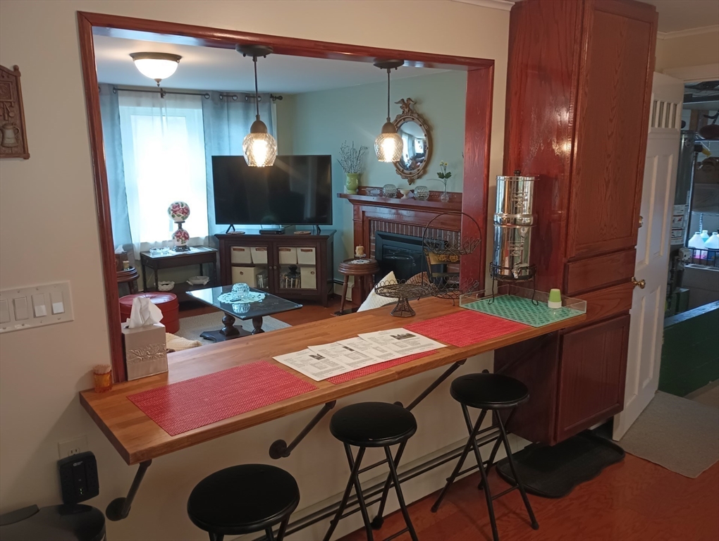 616 County Road Barrington, RI 02806 - Photo 18 of 32 a view of a dining room with a table and chairs