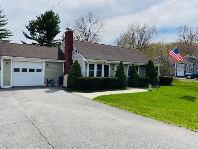 616 County Road Barrington, RI 02806 - Photo 2 of 32 a front view of a house with a yard and garage