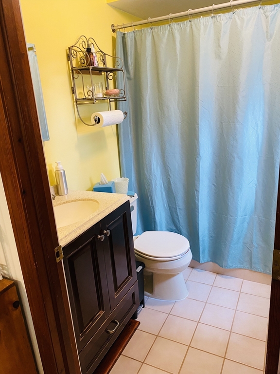 616 County Road Barrington, RI 02806 - Photo 22 of 32 a bathroom with a sink and a mirror