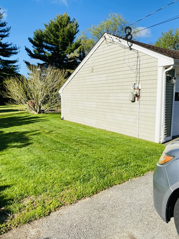 616 County Road Barrington, RI 02806 - Photo 3 of 32 a view of a backyard with plants and a garden