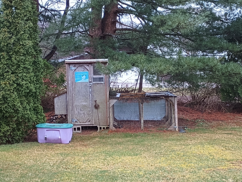 616 County Road Barrington, RI 02806 - Photo 8 of 32 a view of a backyard with a barn