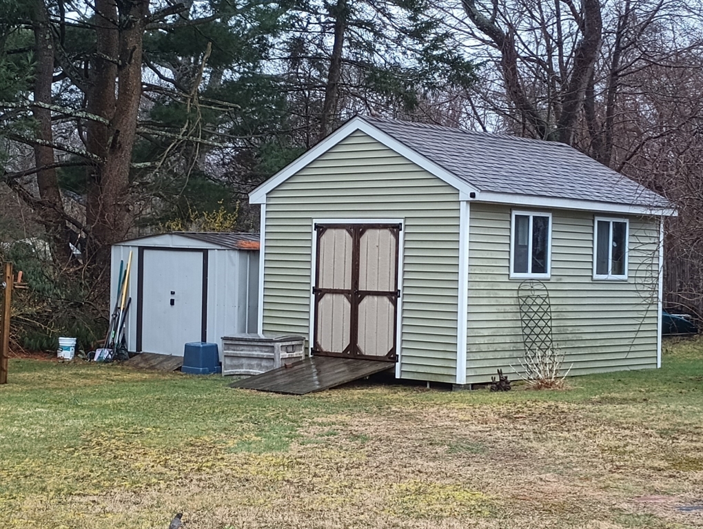 616 County Road Barrington, RI 02806 - Photo 10 of 32 a front view of a house with garden