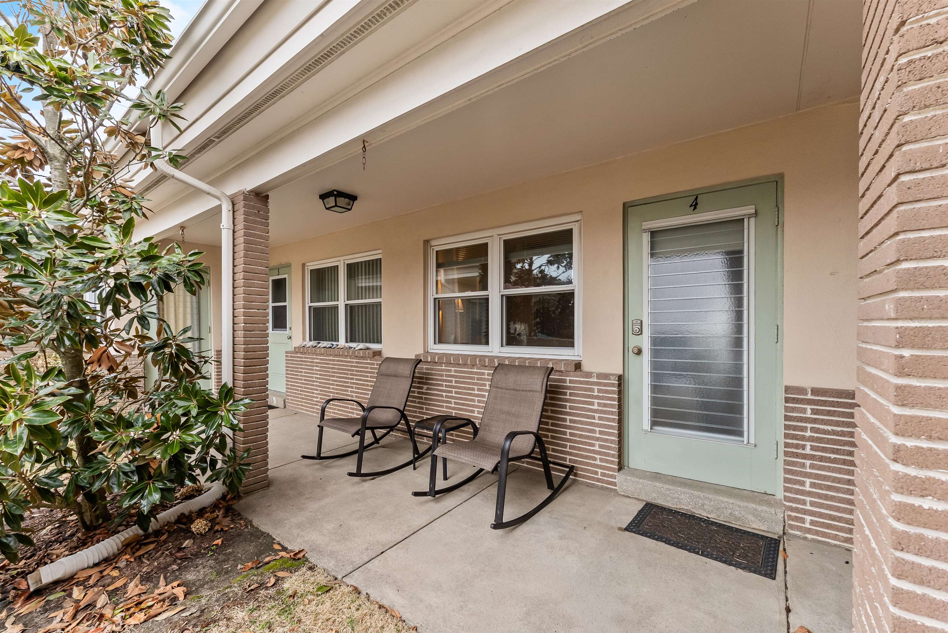 10120 3rd, Unit 4 Strathmere, NJ 08248 - Photo 4 of 14 a view of patio with a table and chairs and potted plants