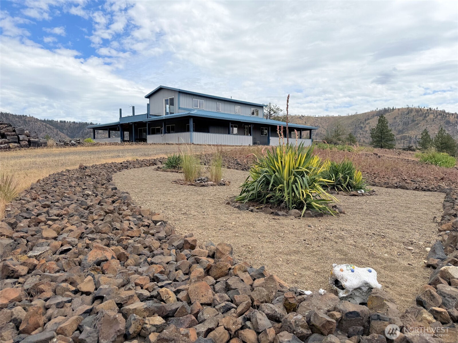 41238 Sterling Valley Road North Lincoln, WA 99147 - Photo 2 of 39 a view of a house with a yard