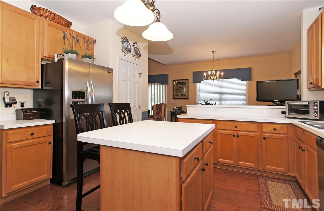 113 Inkster Cove Raleigh, NC 27603 - Photo 10 of 24 a kitchen with stainless steel appliances a sink stove and refrigerator
