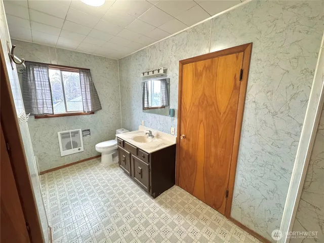 a bathroom with a sink a mirror and a bathtub