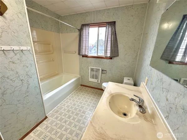a bathroom with a sink and a bathtub