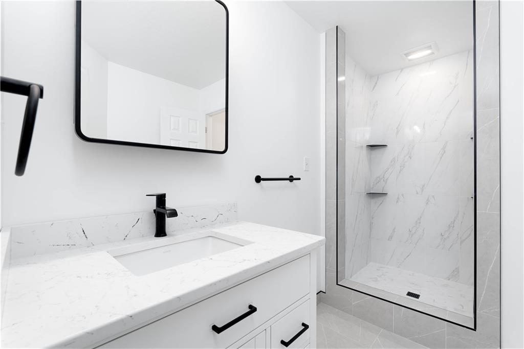 2128 Merriman Way Pittsburgh, PA 15203 - Photo 15 of 37 a bathroom with a sink and a mirror