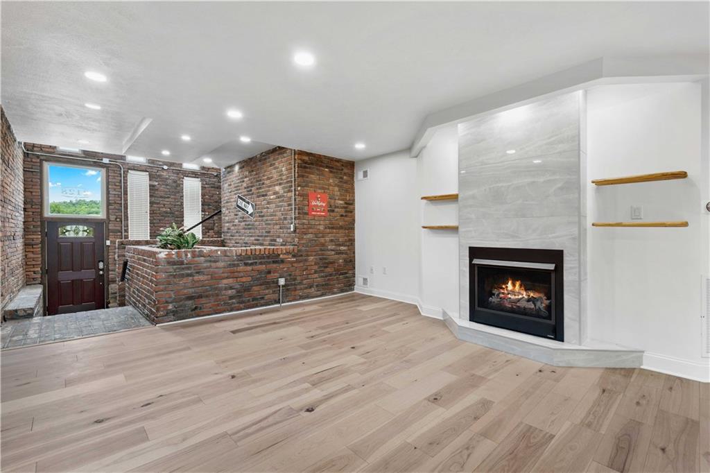 2128 Merriman Way Pittsburgh, PA 15203 - Photo 7 of 37 a view of a fireplace and window in a room