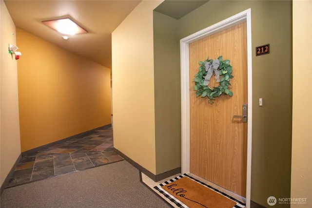 a view of an entryway with a hallway