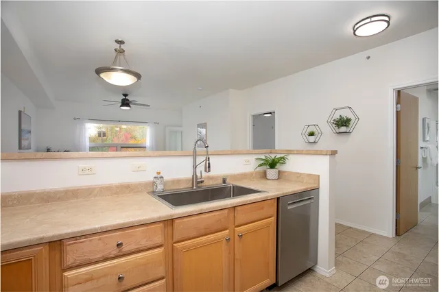 a kitchen with cabinets and window