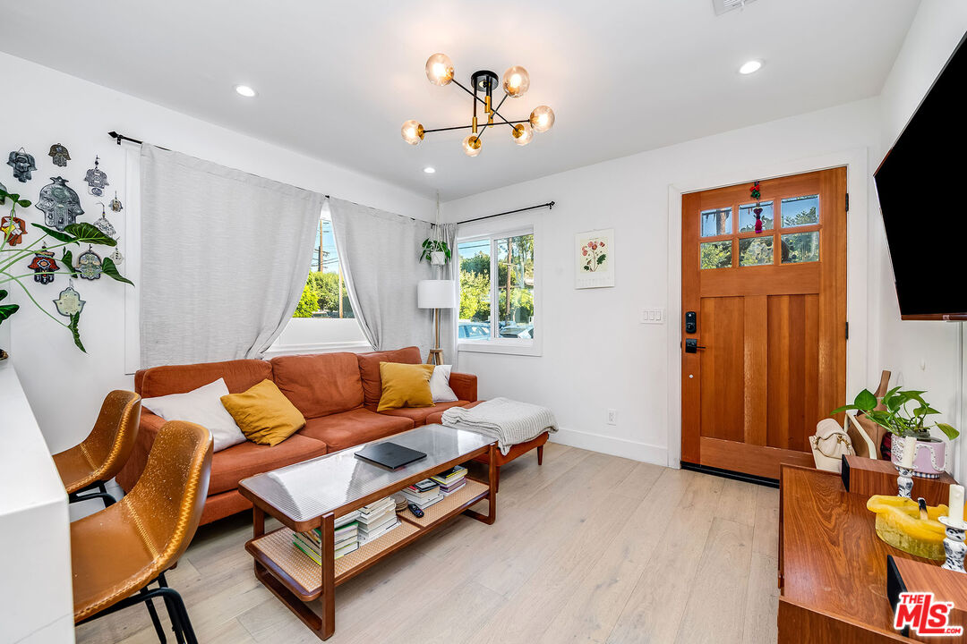 1591 Yosemite Drive Los Angeles, CA 90041 - Photo 11 of 16 a living room with furniture and a flat screen tv