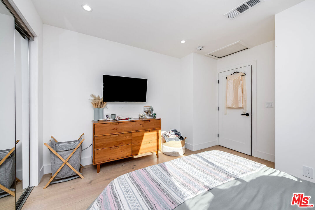1591 Yosemite Drive Los Angeles, CA 90041 - Photo 13 of 16 a bedroom with bed and flat screen tv