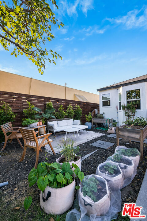 1591 Yosemite Drive Los Angeles, CA 90041 - Photo 3 of 16 a view of a patio with couches and potted plants